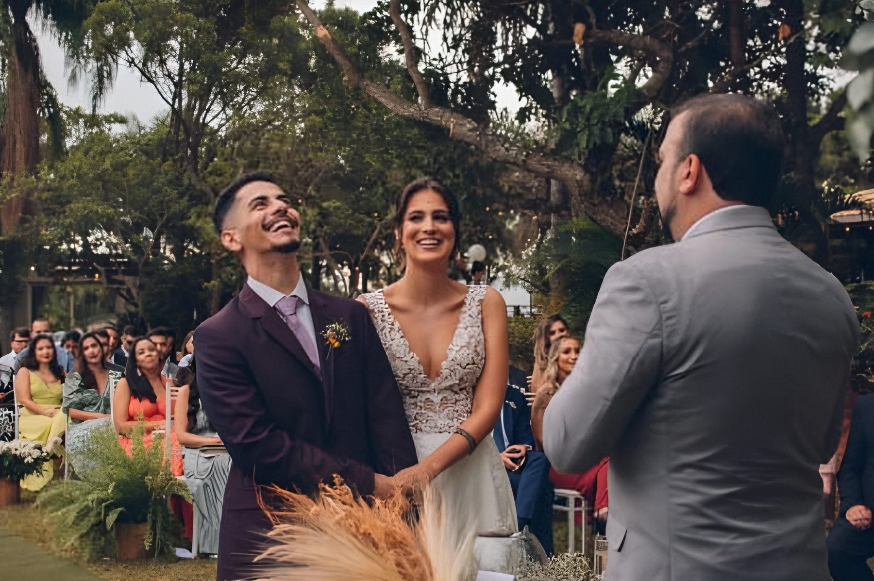 Couple smiling at an outdoor ceremony